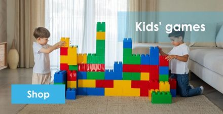 Two boys building a castle with blocks, with the text 'Kids' Games' and a 'Shop' button in the bottom left corner.